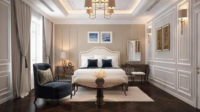 Giường ngủ gỗ óc chó bọc nệm trắng kết hợp đường nét uốn lượn tạo nên điểm nhấn ấn tượng cho phòng ngủ tân cổ điển sang trọng, quý phái. Mẫu thiết kế nội thất biệt thự đẹp